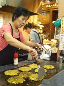 The friendly staff of Takohachi cooking chijimi